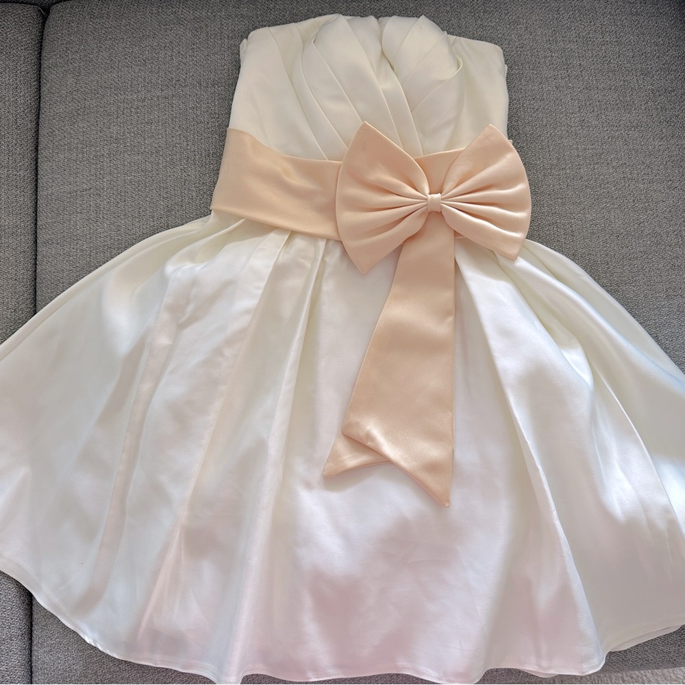 Elegant White Dress with Peach Bow